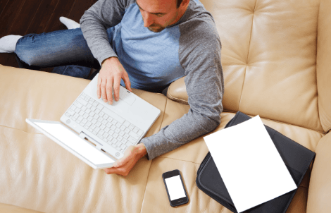 person sitting in front of laptop mobile phone